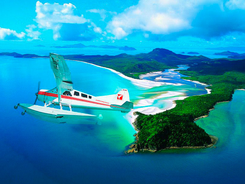 Air Whitsunday seaplane flying over Whitsunday Island